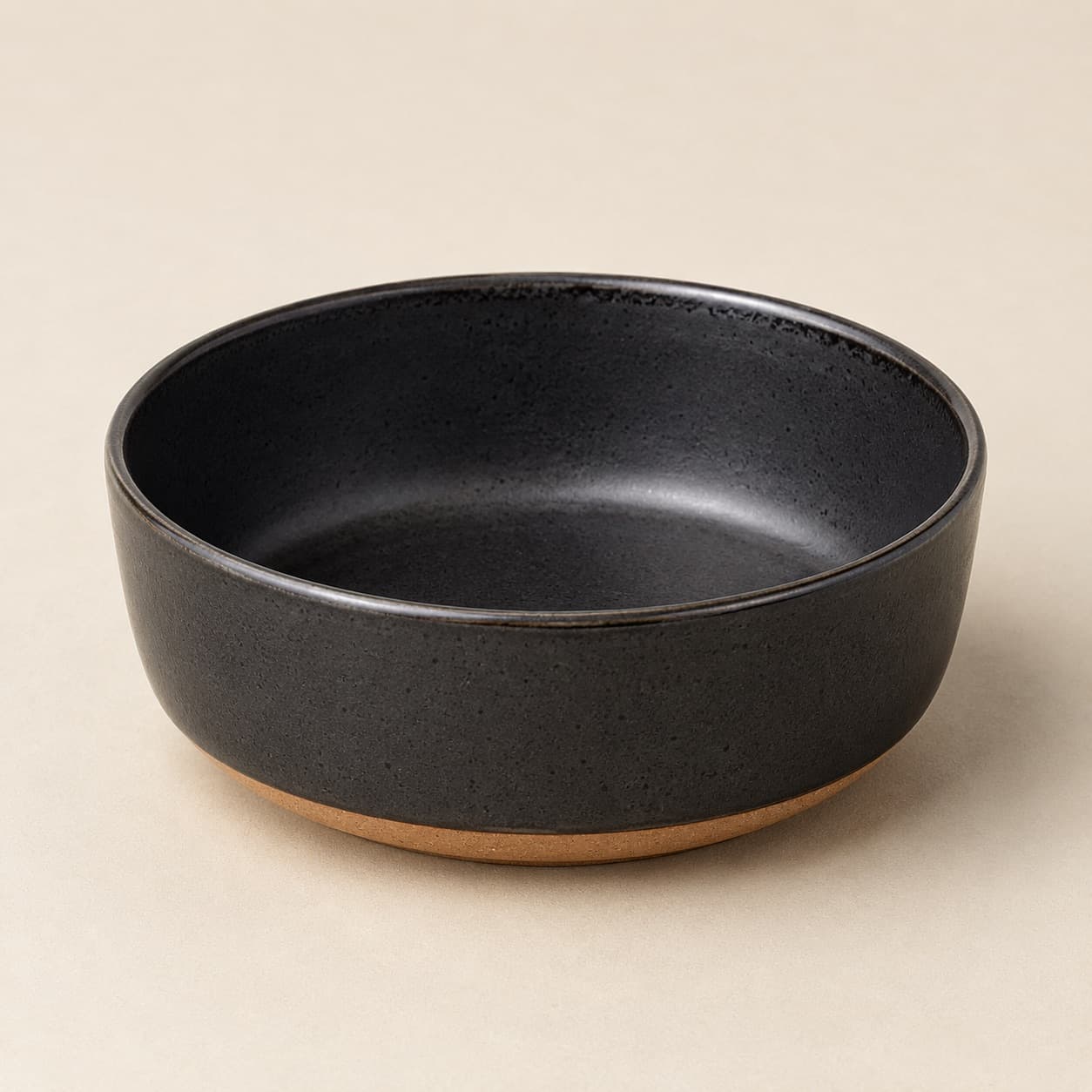 Cereal Bowl Ø15 — charcoal glazed stoneware with an unglazed clay foot ring.