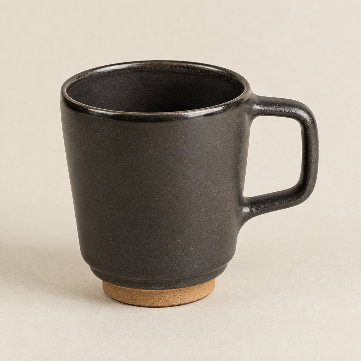 Stacking Mug 300 ml — charcoal glazed stoneware with an unglazed clay foot ring.