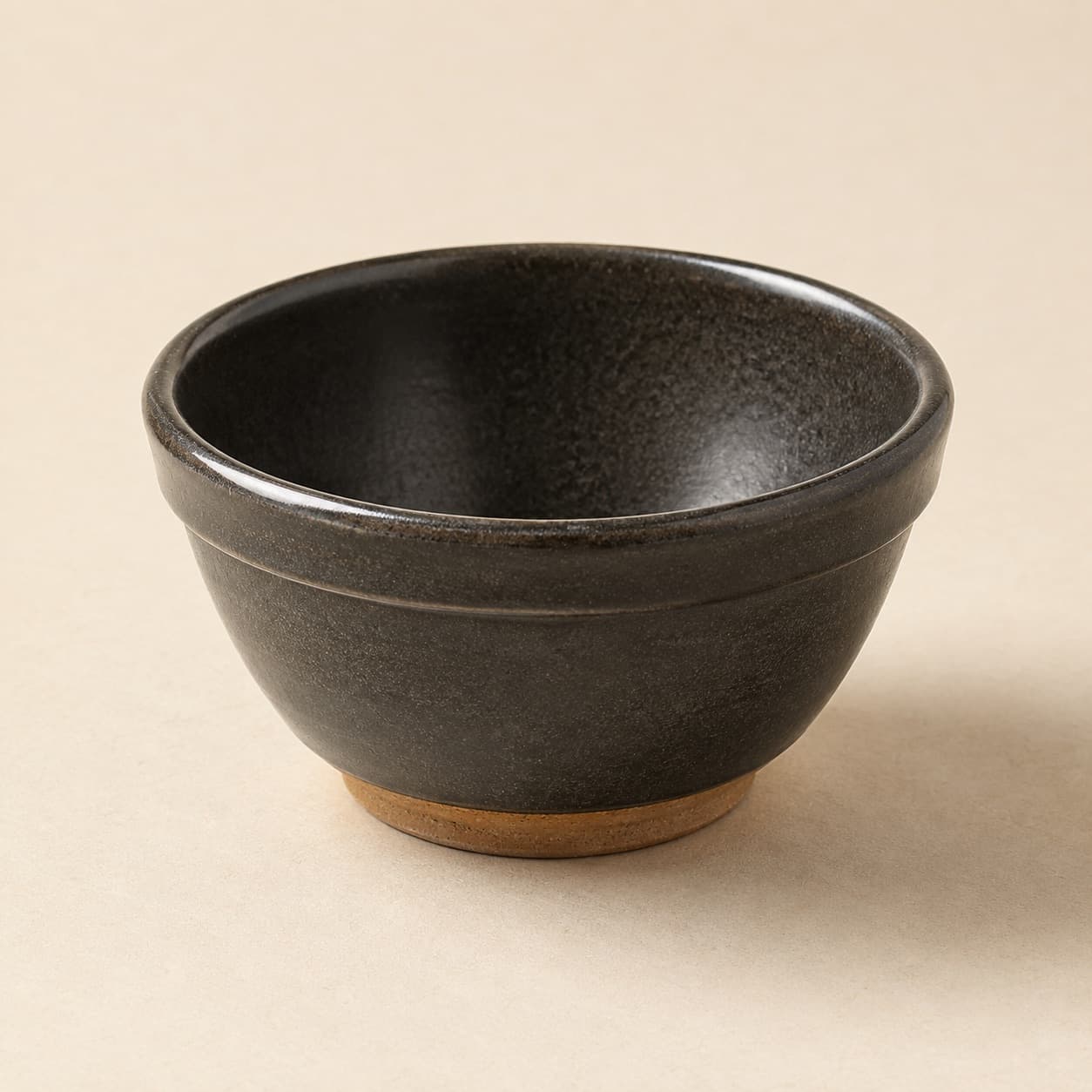 Stacking Prep Bowl Ø12 — charcoal glazed stoneware with an unglazed clay foot ring.