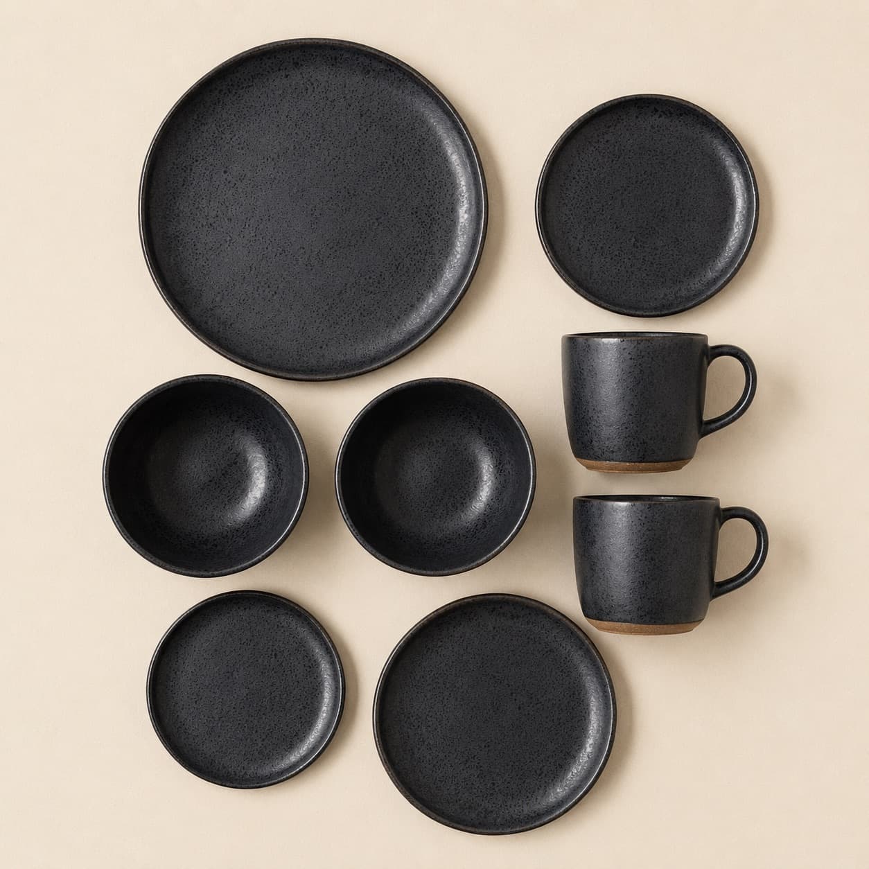 Two-Person Starter Set — charcoal glazed stoneware with an unglazed clay foot ring.